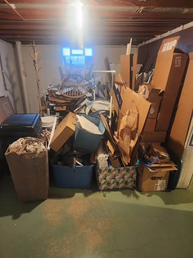 Roll-off dumpster container at job site for 2 Yard Dumpster Rental in Bowdoin