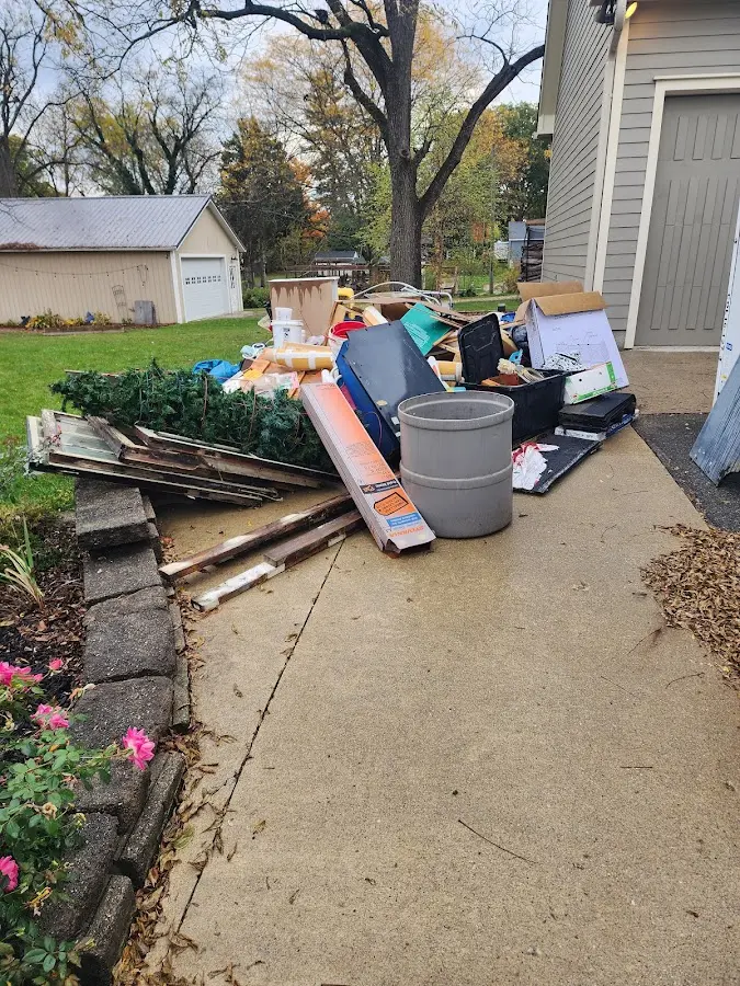 Dumpster being loaded with debris for 3 Yard Dumpster Rental in Bowdoin